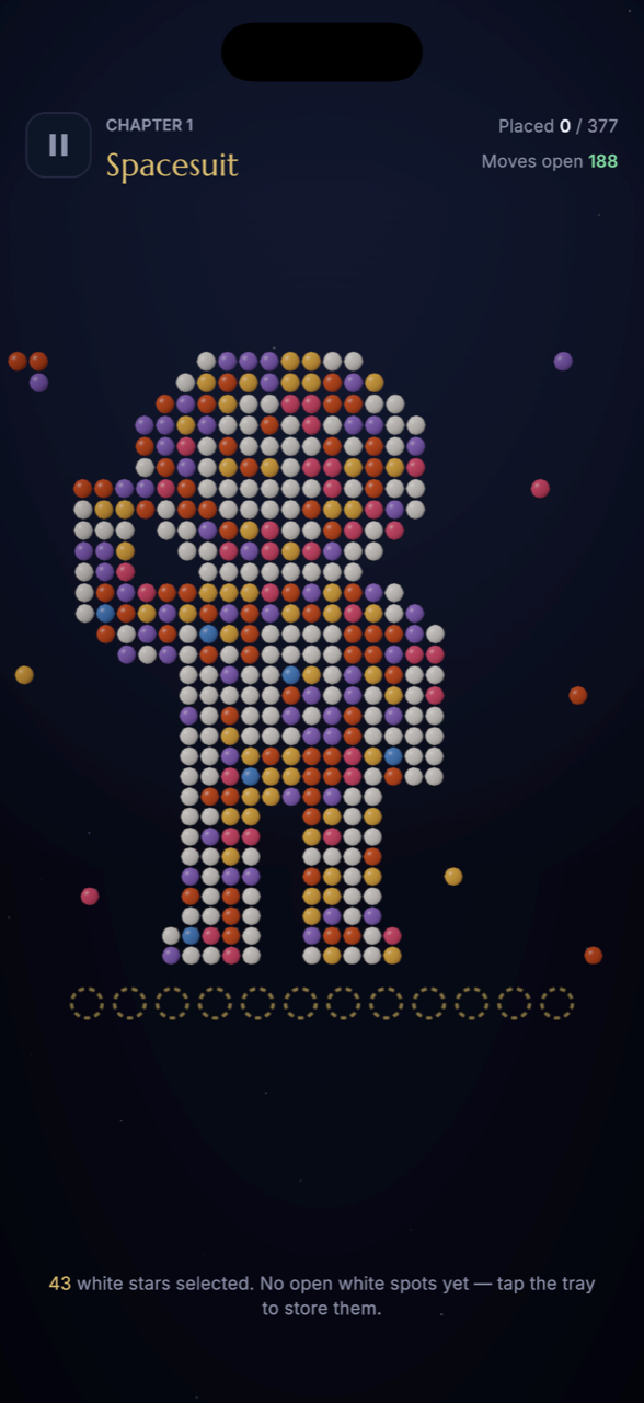 Gameplay board with scattered colored stars and an empty twelve-slot tray